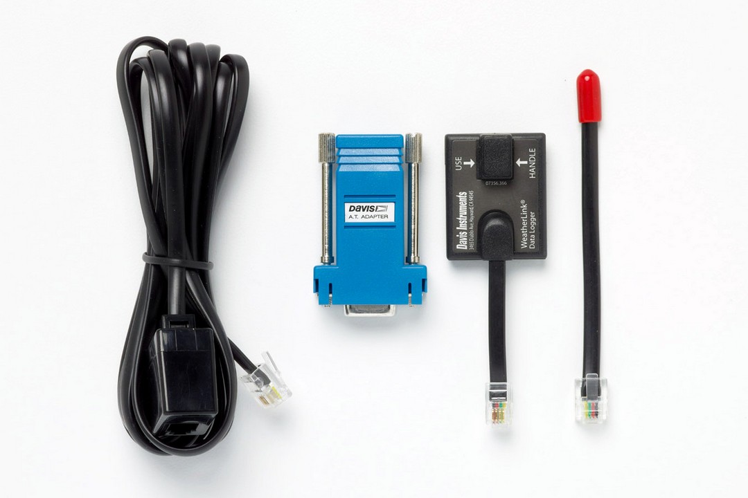 The Davis Instruments WeatherLink Serial Interface unboxed, showing the four components inside.